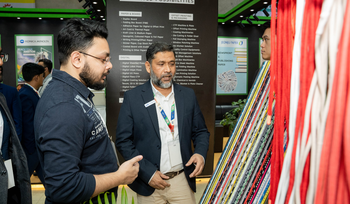 Three professionals collaborating over documents